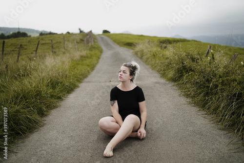 woman sitting on the road