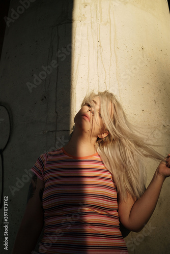 Portrait of a woman with concrete background