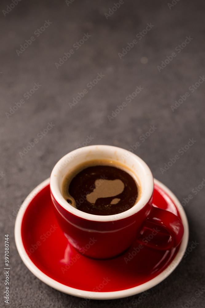 Black brewed coffee in a red cup Black brewed coffee in a red cup
