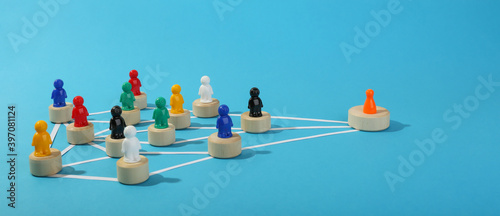 the concept of connections in an abstract community. multicolored figures of people in the form of a community.  photo