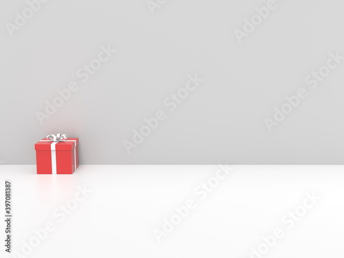 Red Christmas gift box with white ribbon - on white background against white wall © Dimitrius