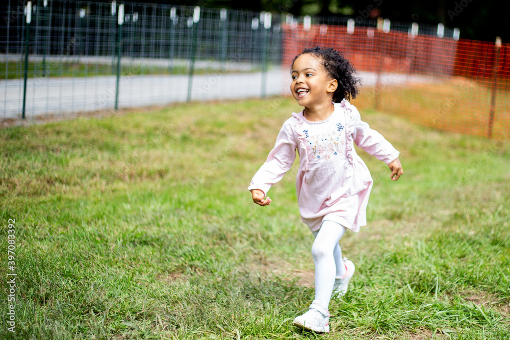 Young toddler running and enjoys the outdoors Young toddler running and enjoys the outdoors