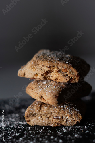 Three sweet bread cakes on a black background, typical sweet in some areas of Spain that is made in autumn photo