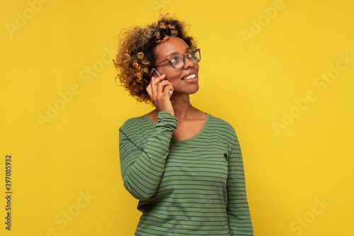 Wallpaper Mural African woman chatting with friend feels happy, talking on phone.