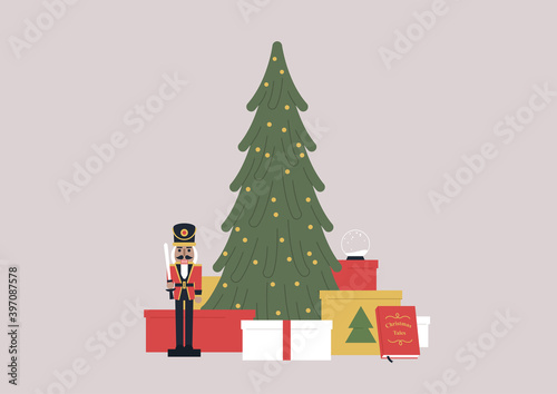 A christmas tree surrounded by present boxes, a nutcracker toy, winter holidays concept