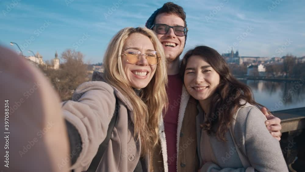 Happy friends taking selfe in Prague. Travel, friendship, youth, millenial, blogger, fame social media concept. Filmed on REd 4k, 10 bit color Happy friends taking selfe in Prague. Travel, friendship, youth, millenial, blogger, fame social media concept. Filmed on REd 4k, 10 bit color