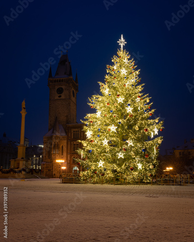 Photography Christmas tree and the Old Town Square in Prague, Czech Republic, covered by fresh snow