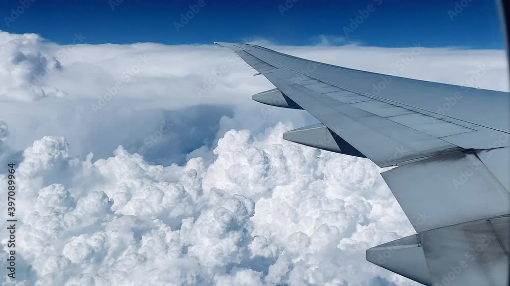 2020 - point of view shot from an airplane flying high above tropical thunderheads and clouds 2020 - point of view shot from an airplane flying high above tropical thunderheads and clouds