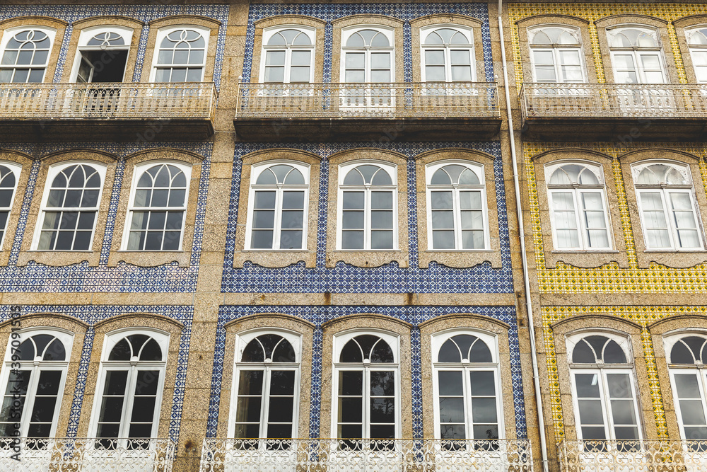 Naklejka premium facade of a building in Portugal Guimarães ajulejos colorful blue yellow 