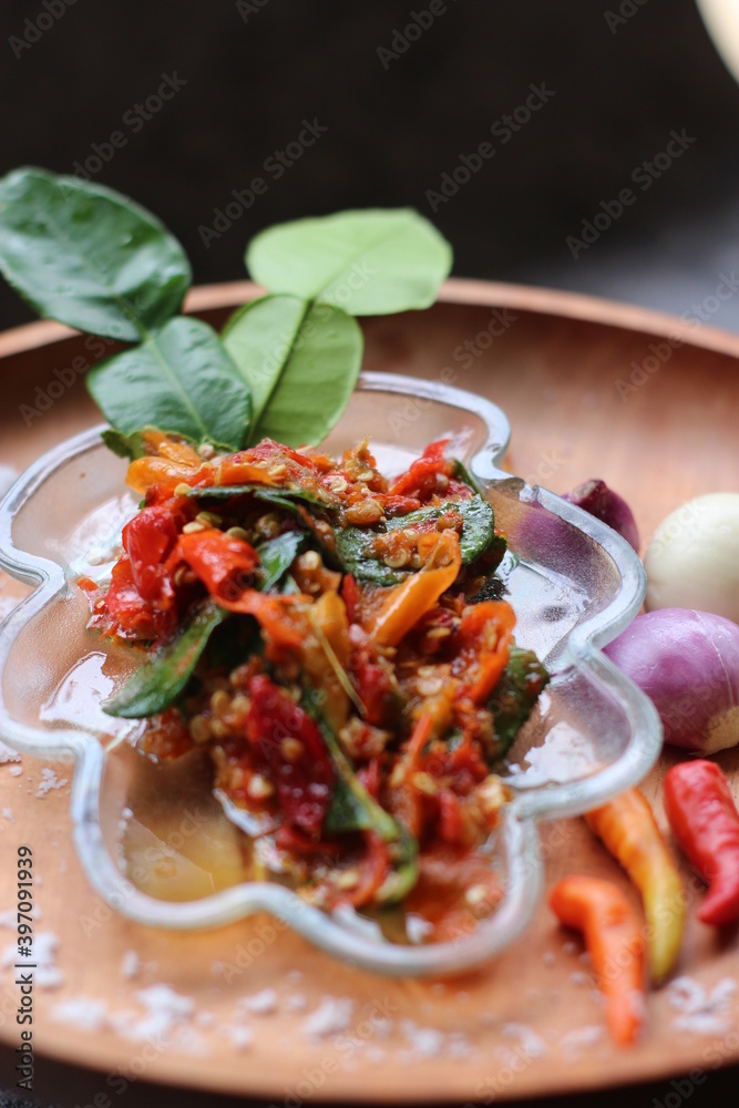 Sambal Jeruk Nipis Or Spicy Lime Sauce with ingredients, Lime, Red Chilies, Green Chilies, garlic, and salt. Sambal Jeruk Nipis Or Spicy Lime Sauce with ingredients, Lime, Red Chilies, Green Chilies, garlic, and salt.