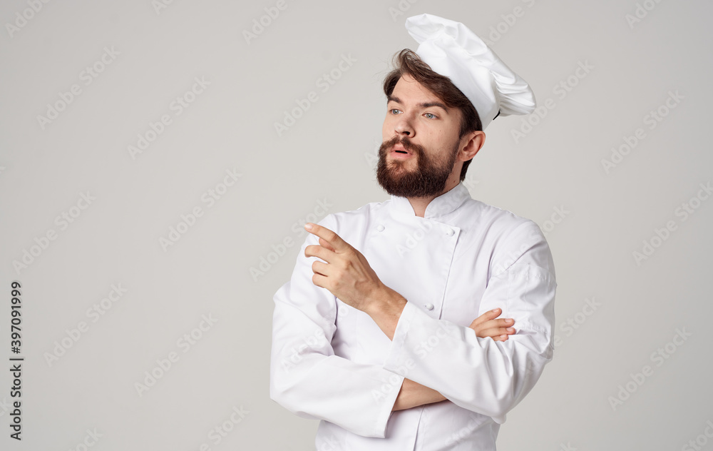Male cook in light clothes and headdress cropped view similar plan portrait Male cook in light clothes and headdress cropped view similar plan portrait