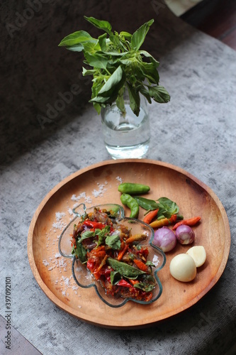 Sambal Kemangi Or Spicy Basil Sauce with ingredients, Basil Leave, Red Chilies, Green Chilies, garlic, salt, and tomatoes