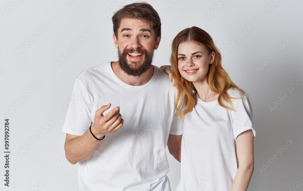 guy and woman in identical t-shirts gesturing with hands cropped view Copy Space