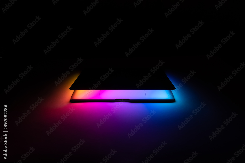 Opened MacBook illuminated with gradient view front - obrazy, fototapety, plakaty 