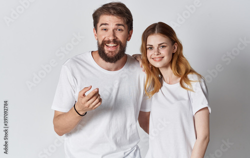 guy and woman in identical t-shirts gesturing with hands cropped view Copy Space