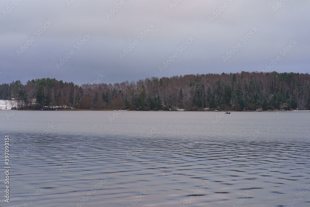 Photography of Russian landscape. Snowy Russian winter coming. Restless Istra water Reservoir.