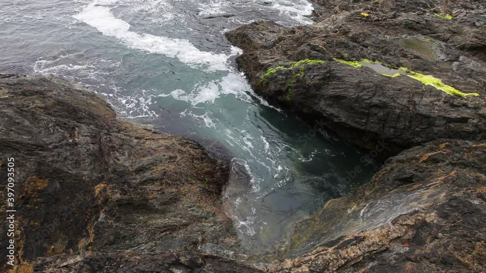 High angle, waves crash on rocky shore in Vancouver High angle, waves crash on rocky shore in Vancouver