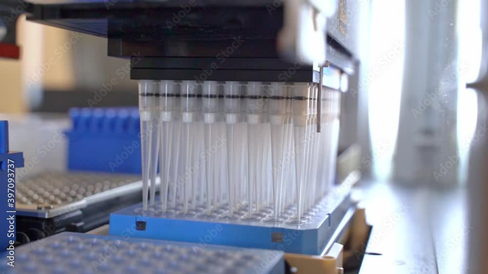 Automation in the clinical laboratory. Pipetting robot laboratory. Medicine robotics. Research and science background