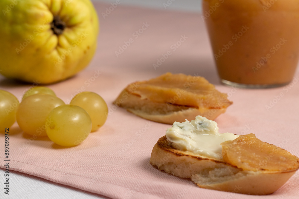 homemade quince jam. slices of bread with cheese and quince jam. homemade quince jam. slices of bread with cheese and quince jam.