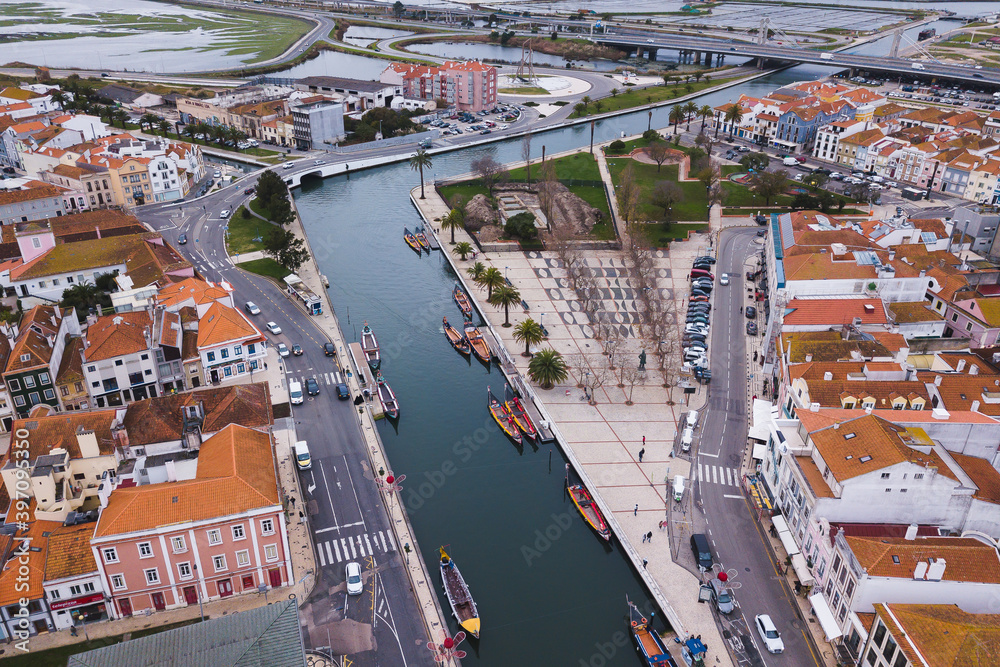 drone shot aerial view from above look Aveiro Portugal cloudy day city center rooftops orange red canal streets boats 