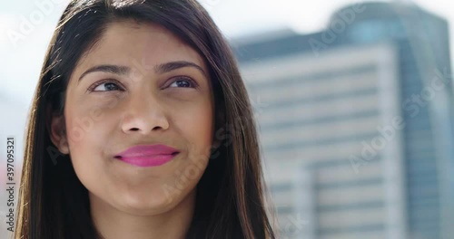 Close up portrait of smiling woman outdoors photo