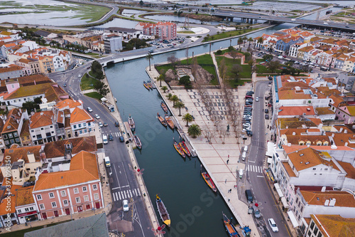 drone shot aerial view from above look Aveiro Portugal cloudy day city center rooftops orange red canal streets boats 