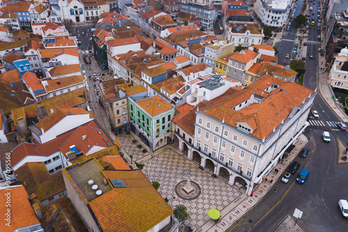 drone shot aerial view from above look Aveiro Portugal cloudy day city center rooftops orange red 