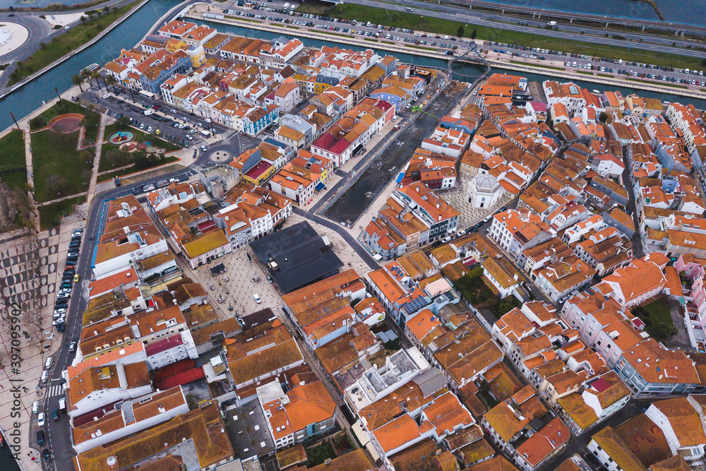 drone shot aerial view from above look Aveiro Portugal cloudy day city center rooftops orange red 