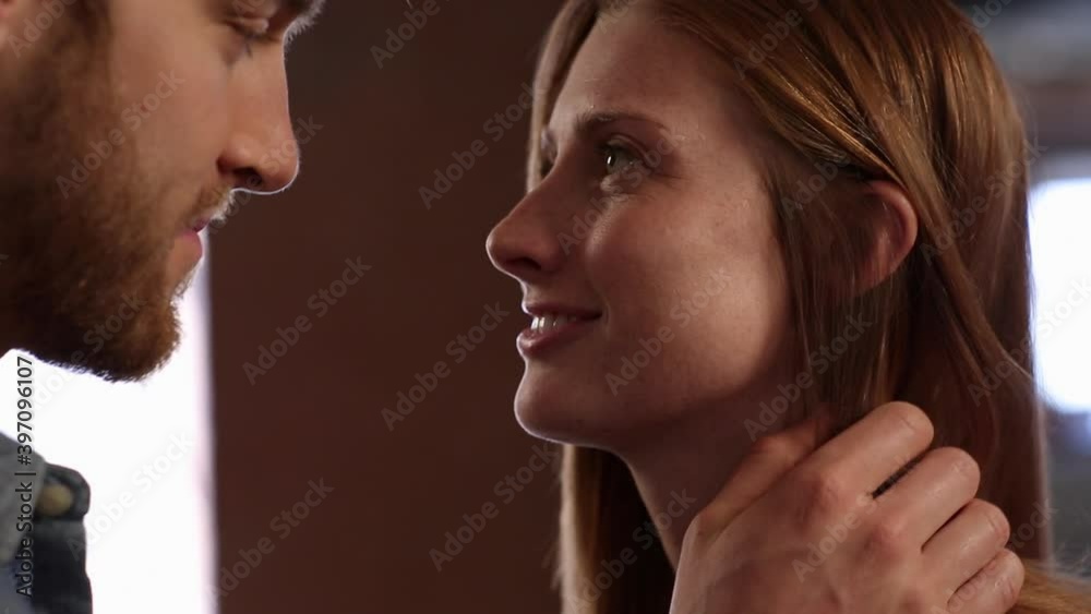 Close up of man touching neck of girlfriend Close up of man touching neck of girlfriend