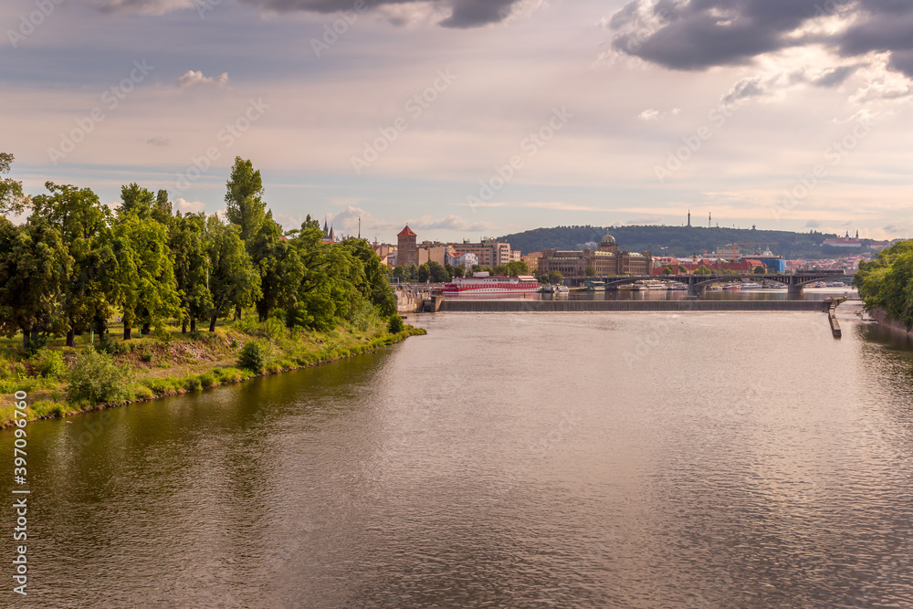 Panoramic view of picturesque Prague city on sunset. River Vltava and Prague bridges. Prague, Czech Republic