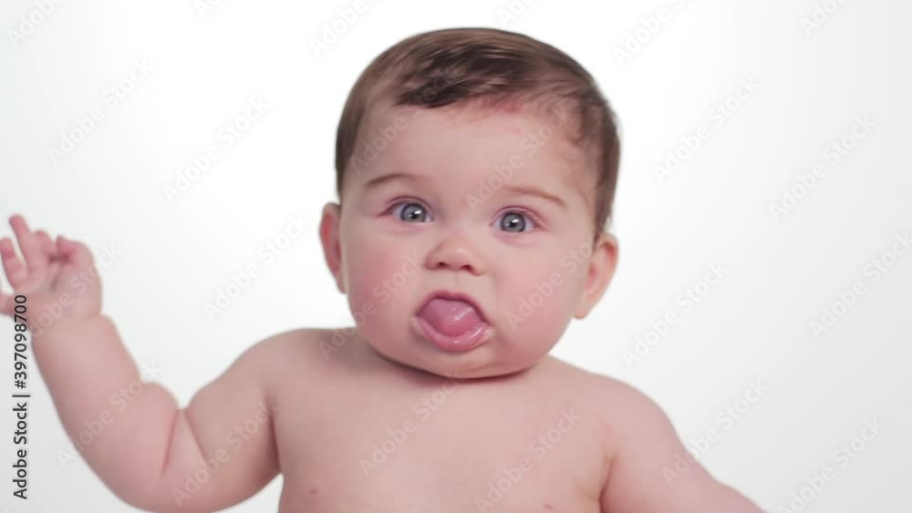 Shirtless Caucasian baby girl looking around Shirtless Caucasian baby girl looking around