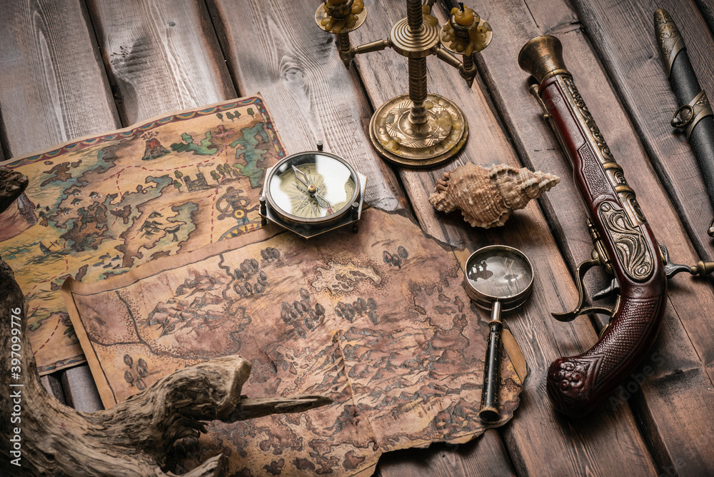 Pirate treasure map on the wooden table background.