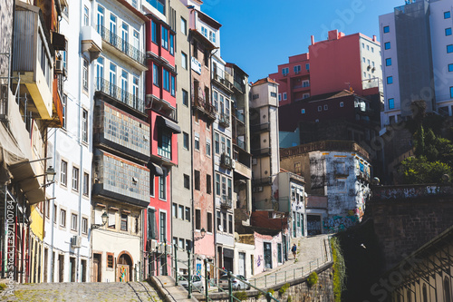 Porto Portugal colorful houses buildings sunny sun blue sky daytime 