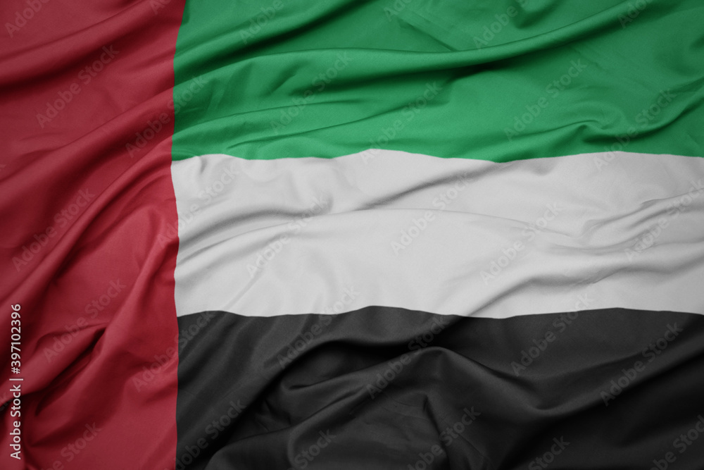 waving colorful national flag of united arab emirates.