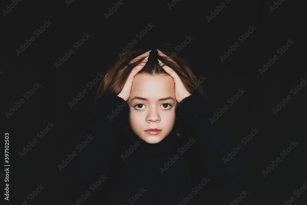 Fototapeta premium Young girl posing in front of the camera