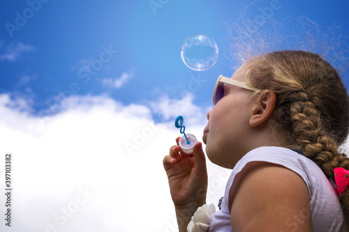 girl , soap bubbles. sky