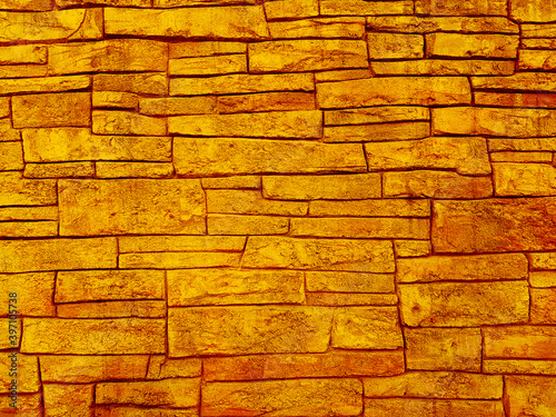 Yellow brick block wall texture background.