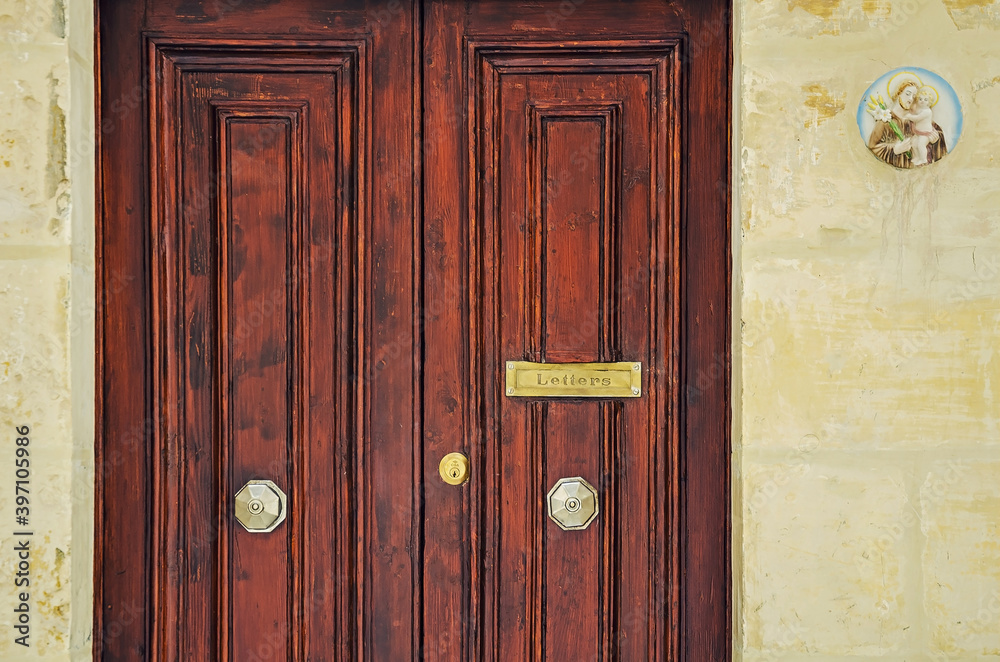 Nice old door and doorknob of the house in Malta Nice old door and doorknob of the house in Malta