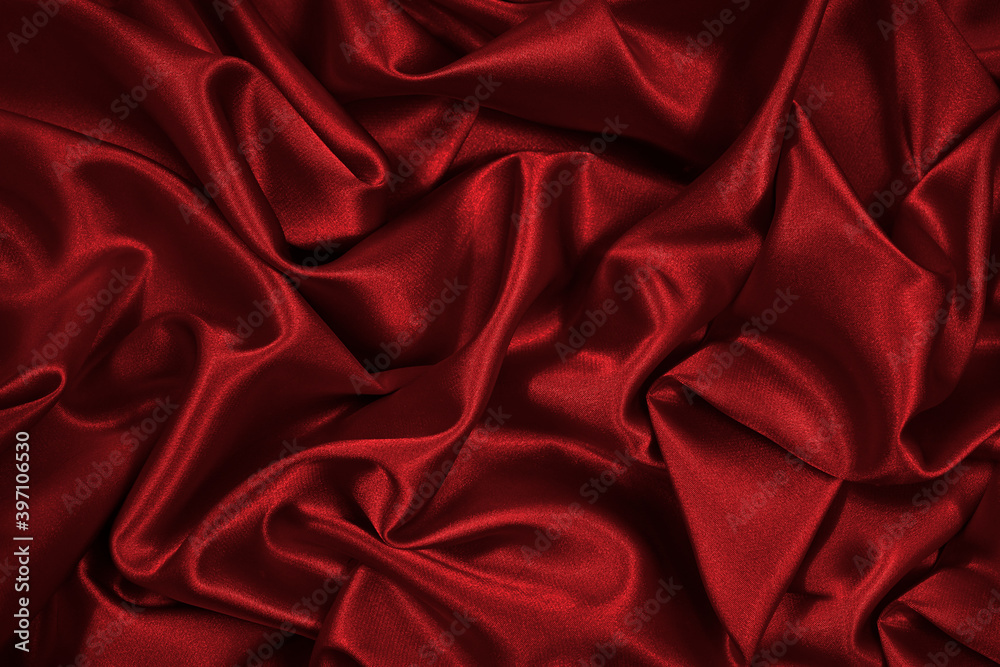 Red silk satin. Red shiny fabric background. Luxurious bright background. Red silk satin. Red shiny fabric background. Luxurious bright background.