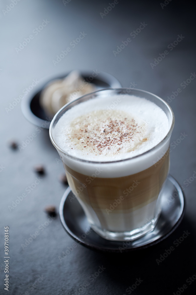 Coffee with milk on dark stone background. Close up.	