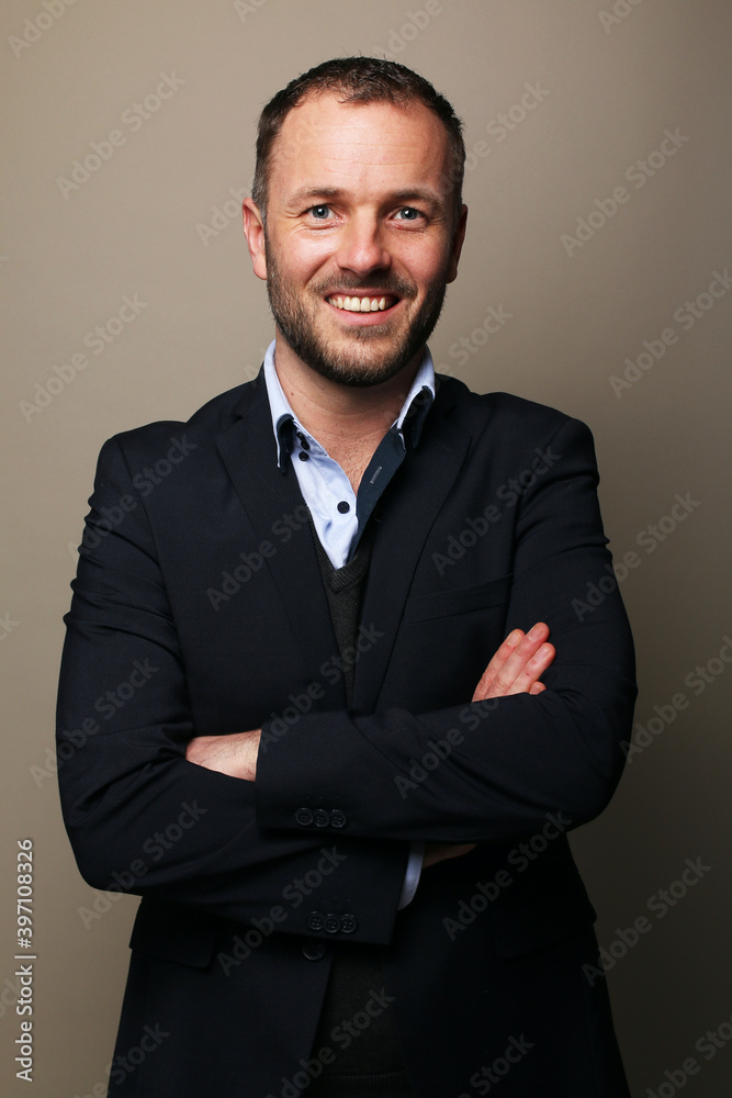 Portrait of a man in front of a colored background Portrait of a man in front of a colored background