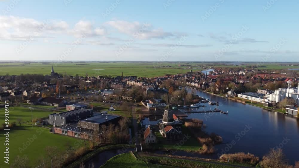 Aerial view flying down around the city IJlst in Friesland, The Netherlands Aerial view flying down around the city IJlst in Friesland, The Netherlands