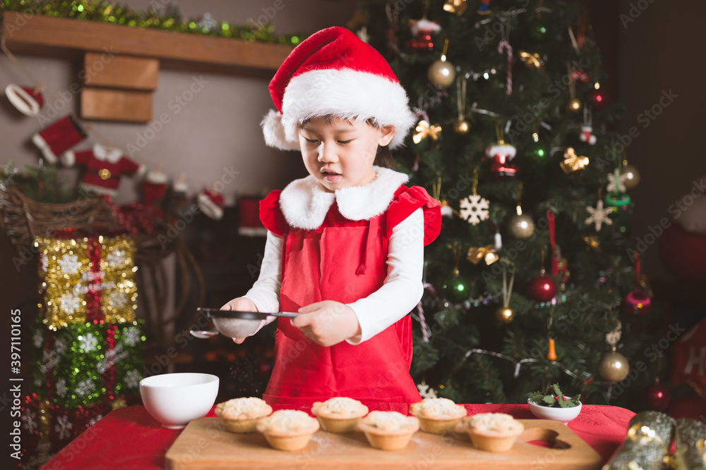 young girl preparing mince pie for celebrating Christmas party young girl preparing mince pie for celebrating Christmas party