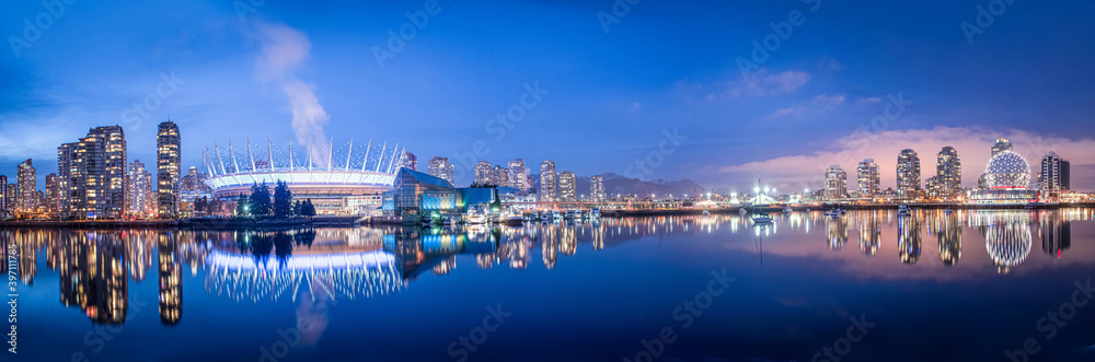 Naklejka premium Panoramic view of Apartments and Science World reflected in False Creek, Vancouver