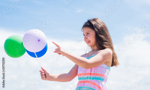 Good for me. happy childrens day. childhood happiness. Concept of freedom and imagination. funny girl have fun on summer vacation. Happy child plays with balloons. happy kid with balloons