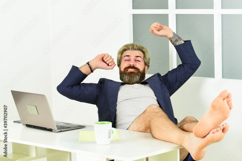 Obraz premium Maintaining regular business hours. Man doing business from home. Procrastination concept. Misconceptions about what telecommuting is really like. Work through evening or procrastinate further