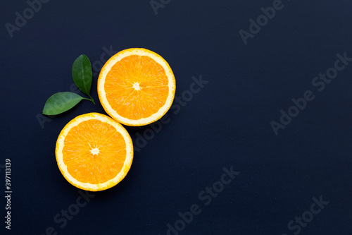 High vitamin C  Juicy and sweet. Fresh orange fruit on dark background.
