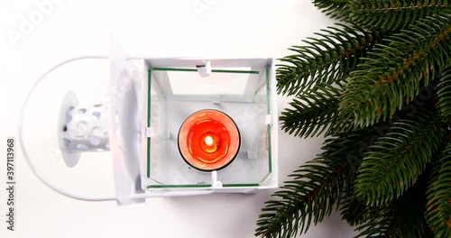 lamp with candles and a branch of a Christmas tree decorative decoration video 4k