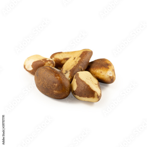 A handful of Brazil nuts on a white background
