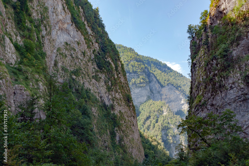 Sheer cliffs against the blue sky with blurry background, used as a background or texture, soft focus Sheer cliffs against the blue sky with blurry background, used as a background or texture, soft focus